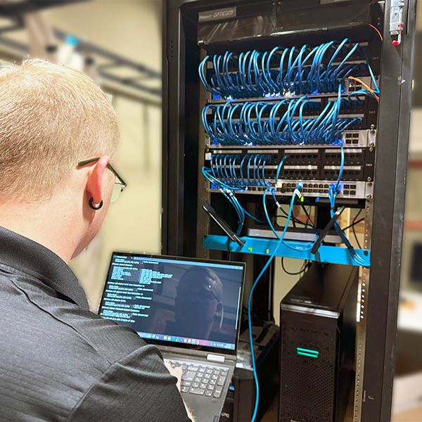 Technician working on a server rack in Bryant, Arkansas